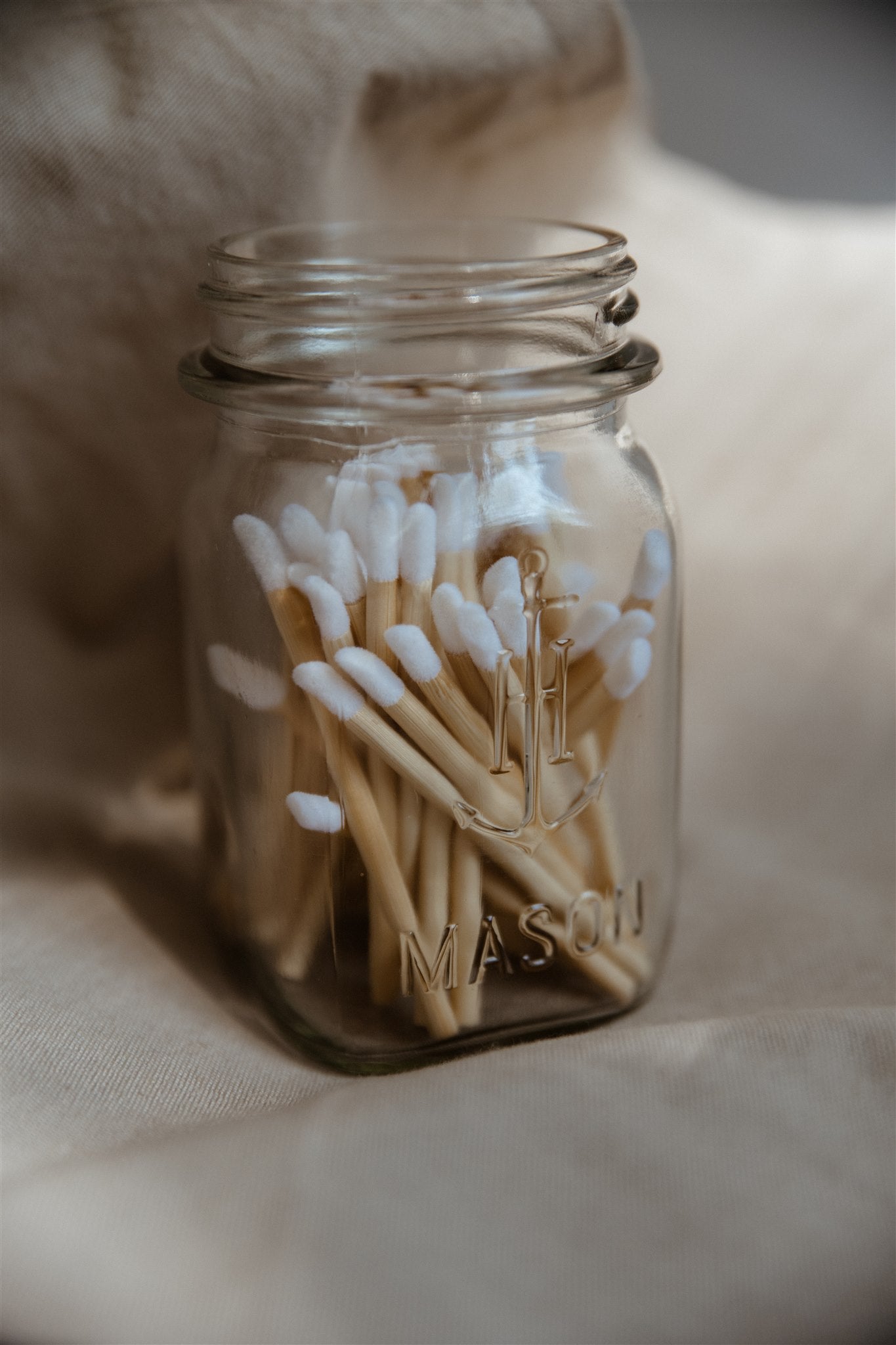 Flocked tip applicators in glass storage